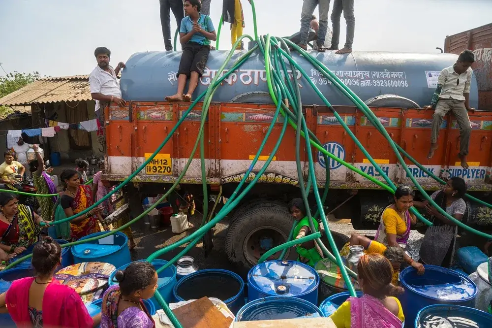 Water tanker supplying clean water to residents during a water shortage